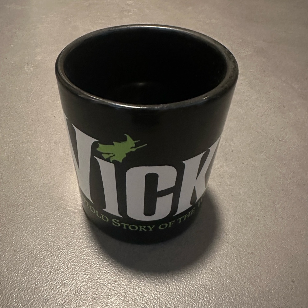 Original Broadway and MotionPicture Wicked Black Mug 
with Green and White Logo